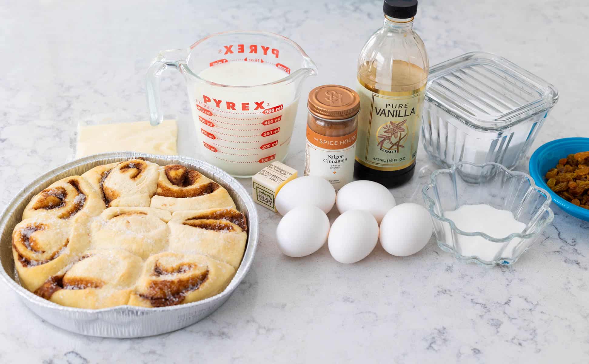 The ingredients to make the cinnamon roll bread pudding are on the counter.