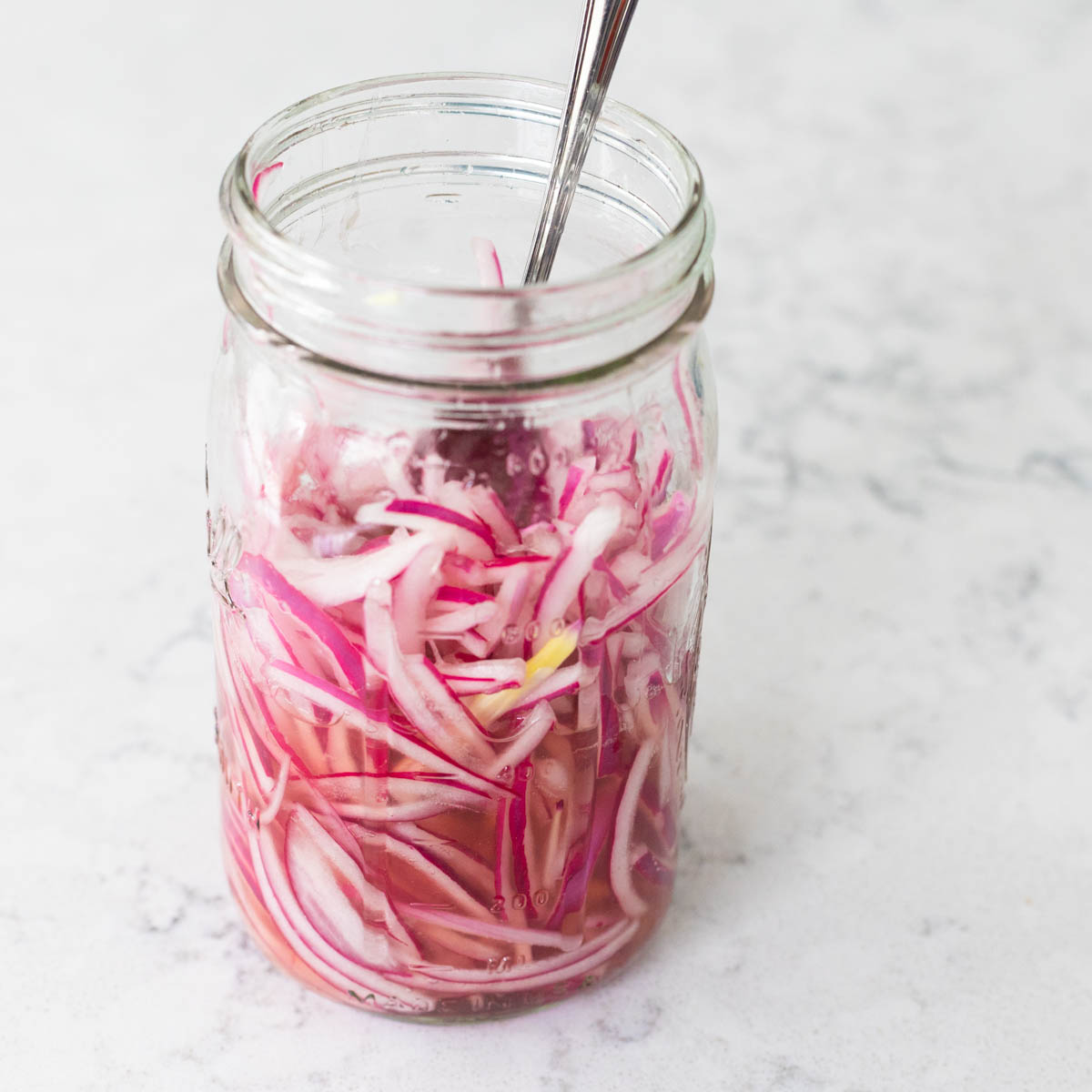 The red onions are now a bright pink inside the mason jar