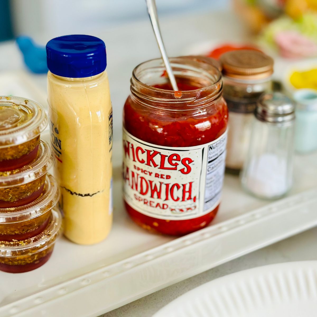 A tray of mustard, relish, and more.