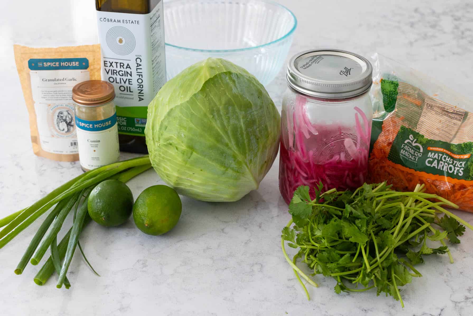 The ingredients to make the Cuban slaw are on the counter.